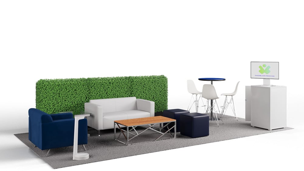 green soft seating set up with life like trees and orange accents