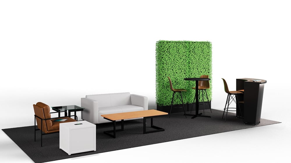 green soft seating set up with life like trees and orange accents