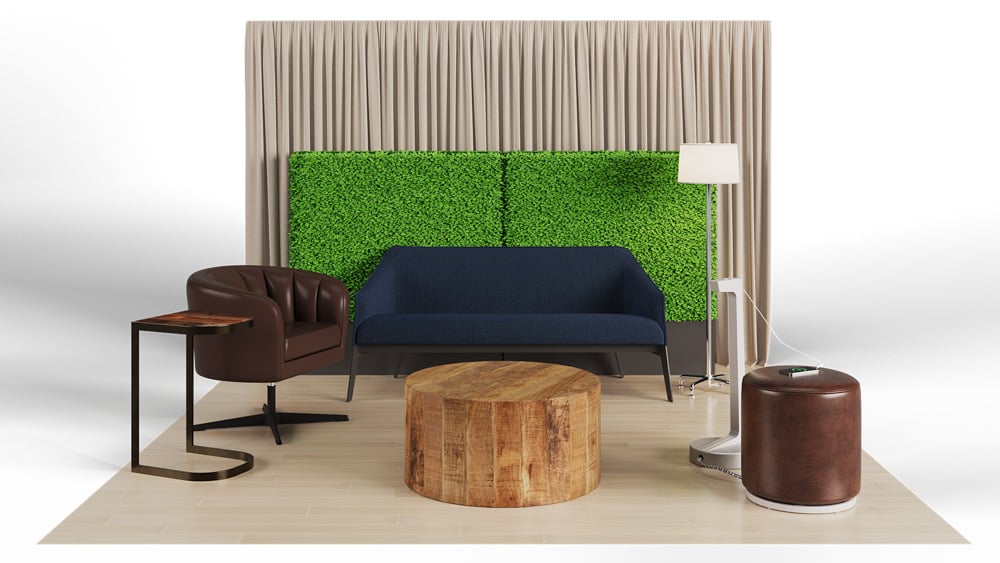 green soft seating set up with life like trees and orange accents