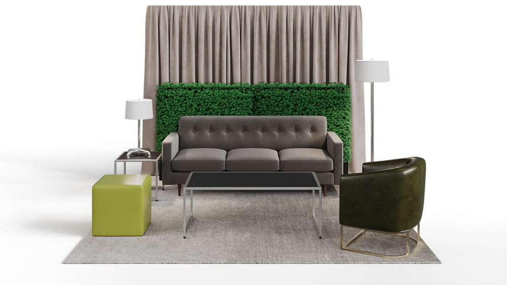 green soft seating set up with life like trees and orange accents