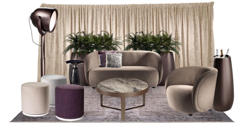lounge area with a neutral toned velvet chair and loveseat paired with greenery and sleek black accent chair