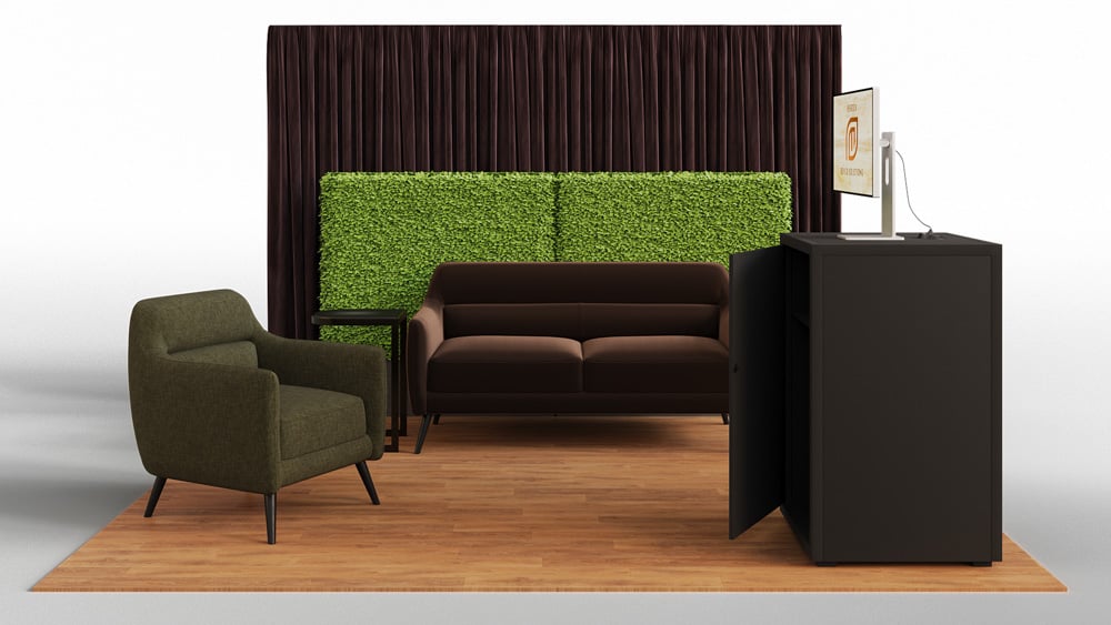 green soft seating set up with life like trees and orange accents