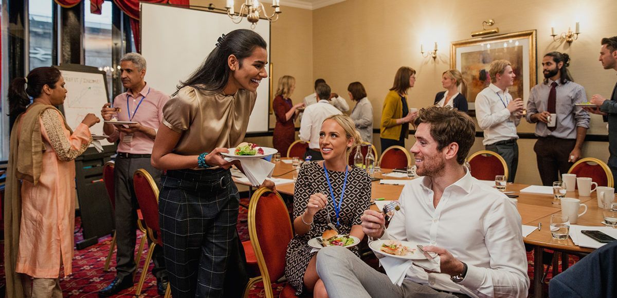 guests eating and socializing at event