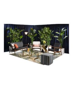 Stylish event rental package with danish-modern soft seating, bronze geometric tables, palm tee planters and tropical rug.