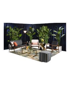 Stylish event rental package with danish-modern soft seating, bronze geometric tables, palm tee planters and tropical rug.