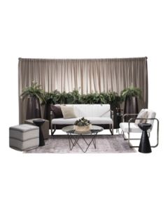 Event rental package featuring white vinyl and chrome soft seating, cube ottomans, glass-top bronze base tables, plastic bronze fern planters, and beige velour drape. 