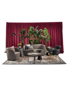 Sophisticated event rental package featuring mink velvet soft seating, black vinyl chair with oak wood-look legs, bronze side tables, palm tree planters, and merlot velour drape. 