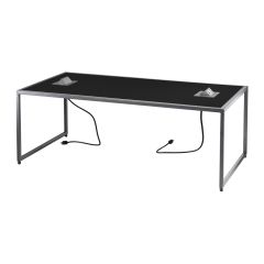 black rectangular cocktail table with two open power hubs