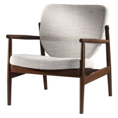 Sand colored fabric accent chair with walnut-metal frame.  