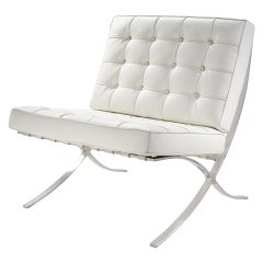 Sophisticated white vinyl wide-seat chair with crossed chrome frame. 