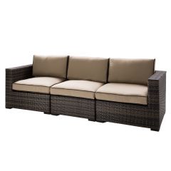 Tan fabric outdoor 3-seat sofa with brown/gray woven frame. 