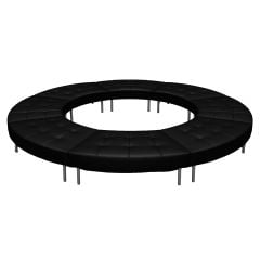 Sleek modular black vinyl closed-circle ottoman with chrome legs.