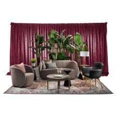 Sophisticated event rental package featuring mink velvet soft seating, black vinyl chair with oak wood-look legs, bronze side tables, havana palm planters, and merlot velour drape. 