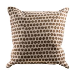 beige pillow with camel brown polka dots