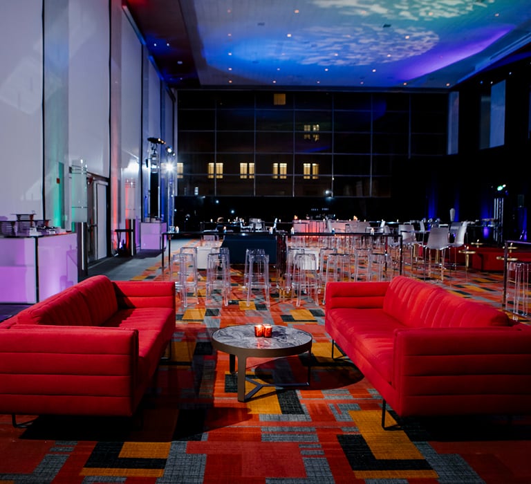 red padded sofas in a hotel ballroom