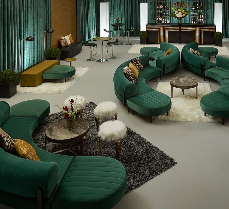 event with emerald green soft seating