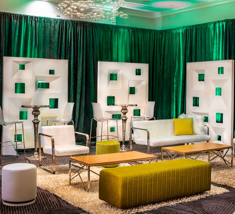 lounge with white furniture and green drape