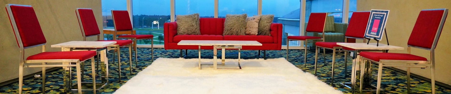 red chairs, red sofa and cream shag rug