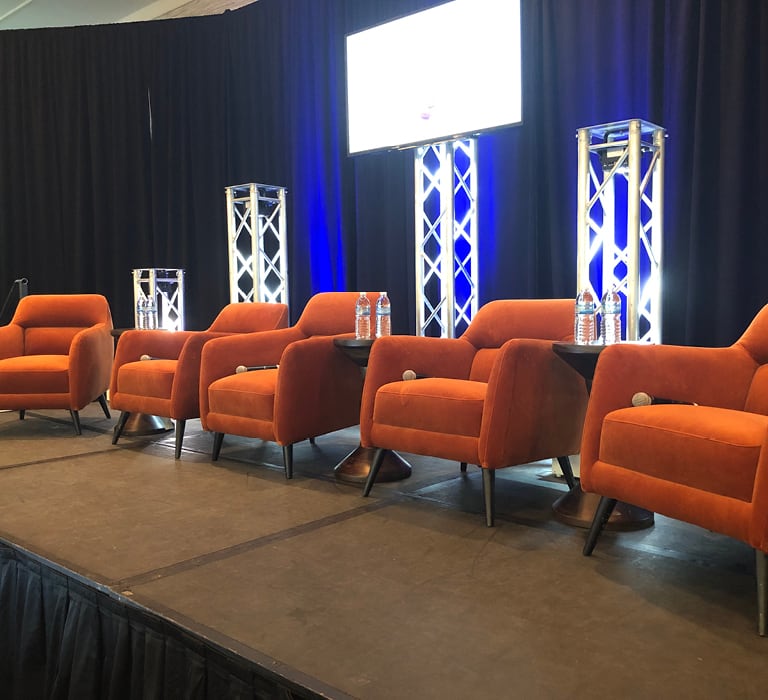 spice orange club chairs on stage