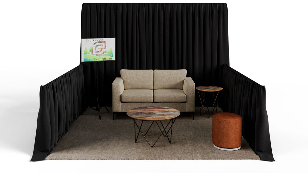green soft seating set up with life like trees and orange accents