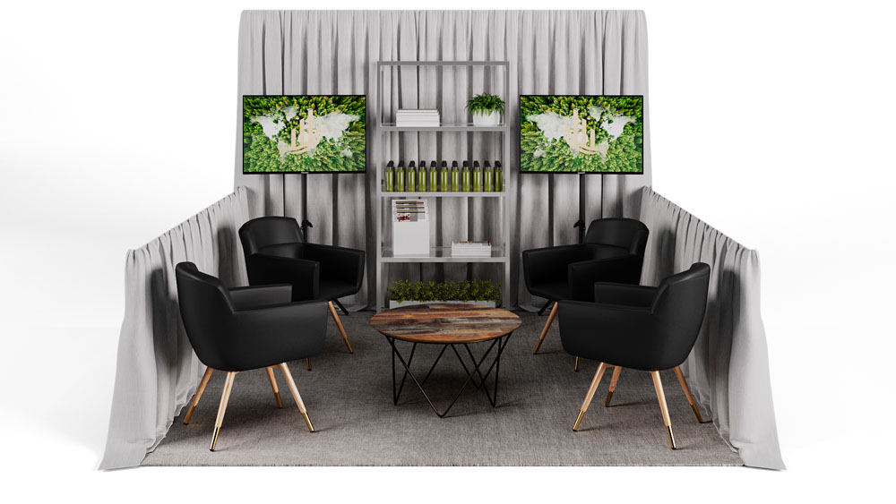 green soft seating set up with life like trees and orange accents