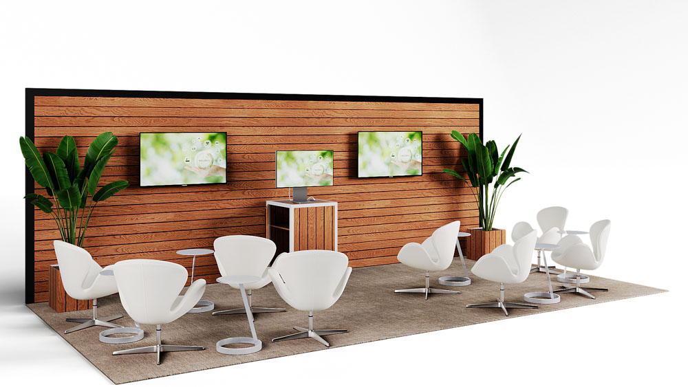 green soft seating set up with life like trees and orange accents
