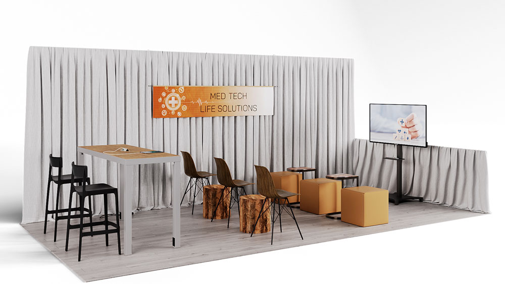 green soft seating set up with life like trees and orange accents