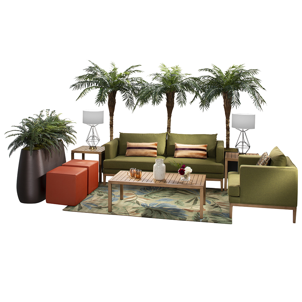 green soft seating set up with life like trees and orange accents